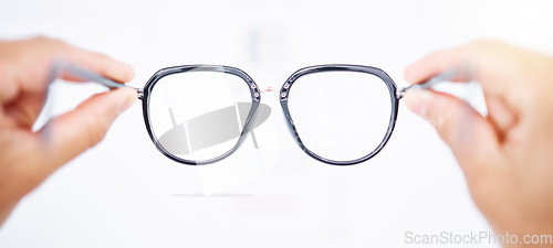 Image of Glasses in hands, frame and vision for eye care, health and person for eyesight improvement, lens and perspective. Closeup, spectacles and optometry, designer eyewear and wellness on white background