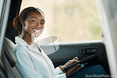 Image of Portrait, tablet and a business black woman a taxi for transport or ride share on her commute to work. Smile, technology and a happy young employee in the backseat of a cab for travel as a passenger