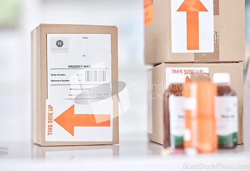 Image of Boxes, medicine and delivery package in pharmacy for ecommerce, supply chain and healthcare on blurred background. Stock, logistics and medical product or drug distribution for health and wellness