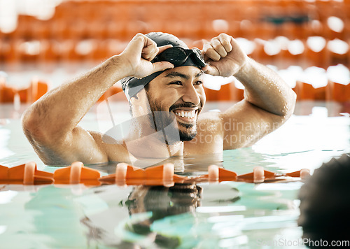 Image of Smile, sports and fitness with man in swimming pool for competition, workout and health. Wellness, happy and exercise with person training in race for performance, contest and speed challenge