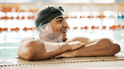 Image of Happy, man and athlete in swimming pool water after training, workout or exercise for wellness, performance or fitness. Swimmer, relax or smile for sport, challenge or health in race competition