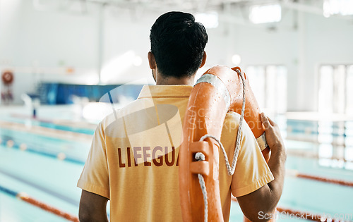 Image of Lifeguard, back and person with swimming, pool or safety lifebuoy for rescue support, help or life saving. Surveillance attention, equipment and expert for protection, security or medical emergency