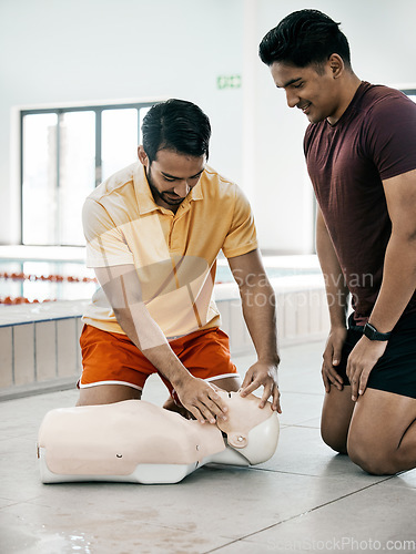 Image of Swimming pool safety, CPR and people learning, coaching or life saving, rescue or drowning victim support. Teaching medical service, emergency first aid knowledge or men training on mannequin