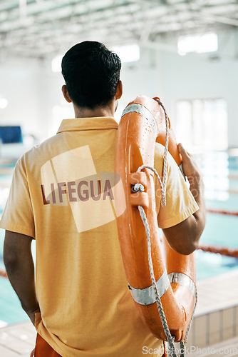 Image of Swimming pool lifeguard and person with lifebuoy safety equipment and watch for rescue support, help or service. Surveillance, attention and back of expert for emergency assistance for public danger