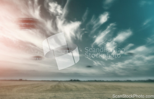 Image of UFO, spaceship and nature with alien in sky with fantasy or science fiction event in countryside, field or landscape with clouds. Earth, aliens and extraterrestrial drone in environment with blur