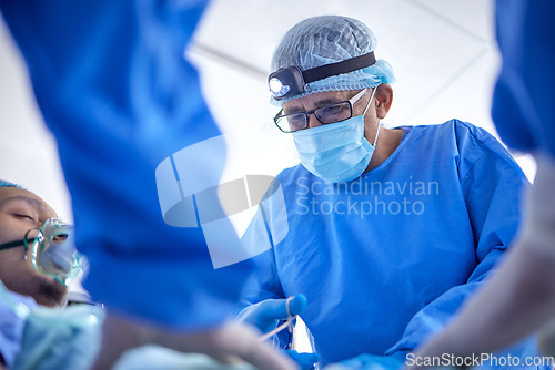 Image of Scissors, hospital and surgeon team in theatre for emergency, healthcare or medical procedure. Doctors with a patient to start collaboration, surgery and operation with support and scrubs in ICU