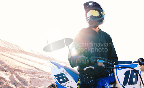 Image of Ready, sand or sports athlete on motorcycle for action, adventure or fitness with wellness, or adrenaline. Thinking, view or free driver on motorbike on dunes in training, exercise or race challenge