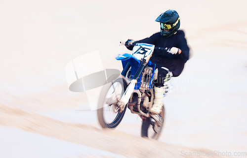 Image of Sand, hill or athlete with motorbike for action, adventure or fitness with performance for adrenaline. Fast, speed or sports person on motorcycle on dunes for training, exercise or race or challenge
