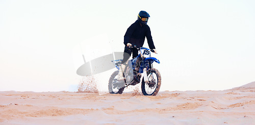 Image of Desert, dust or athlete driving motorcycle for action, adventure or fitness with performance or adrenaline. Sand sports or person on motorbike on dunes for training, exercise or race or challenge