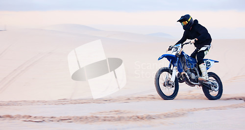 Image of Sand, speed or athlete driving motorbike for action, adventure or fitness with performance or adrenaline. Fast, nature or sports person on motorcycle on dunes for training, exercise or race challenge