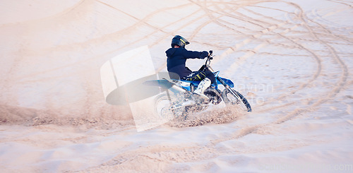 Image of Dirt, sand or athlete driving motorbike for action, adventure or fitness with performance or adrenaline. Nature, dust or sports driver on motorcycle on dunes in training, exercise or race challenge