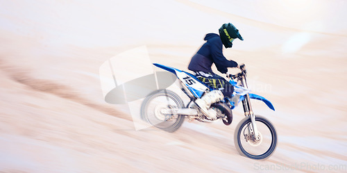 Image of Dirt, motorbike and athlete in sports, adventure and man driving on desert, sand dune and outdoor riding in nature. Extreme sport, bike or motorcycle drive with helmet, gear or person with freedom