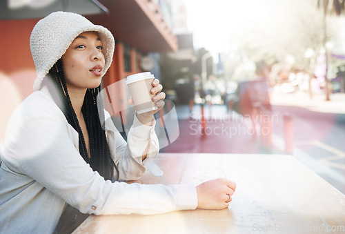 Image of Outdoor, coffee shop and woman relax with drink at cafe, restaurant or table at bistro with gen z in streetwear or urban fashion. City, style and girl in town drinking cappuccino in cup with bokeh