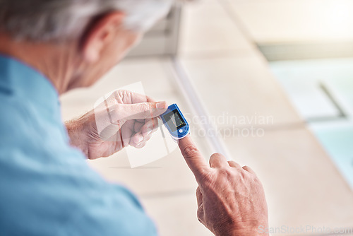 Image of Closeup, digital oximeter and elderly hands measure oxygen saturation, pulse or heart health. Finger, blood test monitor and senior man in retirement home for healthcare, medical check and wellness