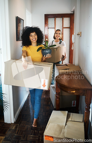 Image of Excited, homeowner or couple with boxes, lesbian or moving with real estate, achievement or happiness. Queer people, happy women or girl with marriage, mortgage or new apartment with property or love