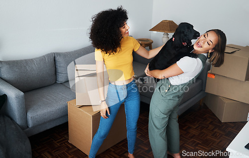 Image of Dog, smile and gay couple in new home, play and bonding together in living room. Happy lesbian women with pet in house, apartment and moving in to real estate property, having fun and carrying animal