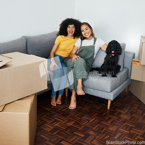 Image of Dog, lesbian couple and new real estate, portrait and bonding together in living room. Happy gay women with pet in house on sofa, apartment and moving in to property home, laughing and funny animal