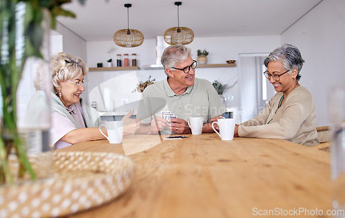 Image of Playing cards, bonding and senior friends with coffee to relax in retirement with a game in a home. Talking, together and a senior man with women or people at a table for fun, break or happiness