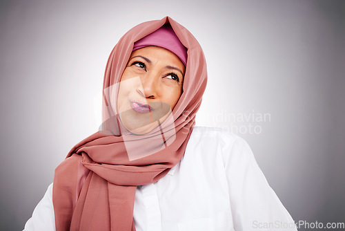 Image of Fashion, smile and Muslim woman thinking in studio isolated on a gray background. Happy Islamic female model in makeup, cosmetics and confident in trendy clothes, traditional hijab and stylish scarf