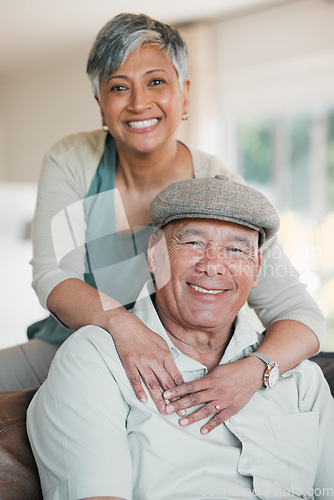 Image of Senior couple, portrait and love in home for happy retirement, loyalty to partner and commitment to marriage. Man, woman and smile for support, trust and freedom to relax in living room together