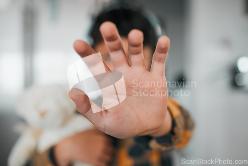 Image of Child, stop and hand closeup for protest, rejection and sign for prohibition of domestic violence. Palm, warning and kid against discrimination, racism and bullying at school, abuse and harassment