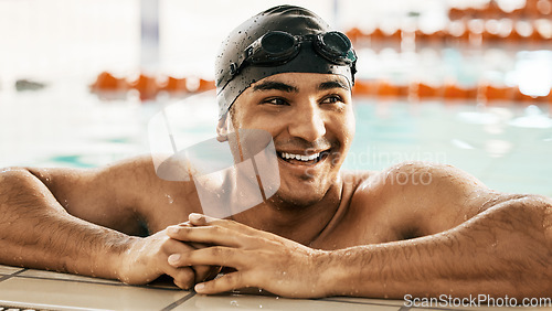 Image of Happy, man and athlete relax in swimming pool after training, workout or exercise for wellness or cardio fitness in gym. Swimmer, smile and enjoy sports challenge or summer water polo competition