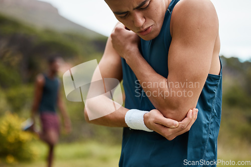 Image of Sports man, nature and elbow pain from workout training injury or fitness running accident outdoors. Bad bruise, broken arm bone or closeup of injured athlete runner with exercise emergency in park