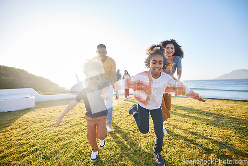Image of Nature, excited and family running, have fun and playing games, parents chase children and bond on summer travel vacation. Energy, sunshine and happy kids, mom and dad love, care and freedom together