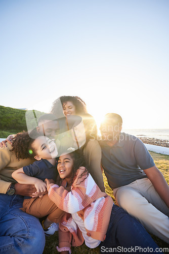 Image of Parents, grandparents and happy children hug outdoor or laughing together on funny vacation in summer. Big family on grass for holiday in nature with care of men, women and kids for sunset sky banner