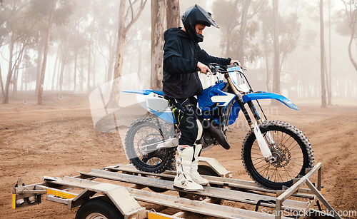 Image of Motorbike, man and sports in forest with training for competition, riding in nature with action and helmet. Extreme, adrenaline and exercise, athlete and transport with dirt bike, freedom and travel