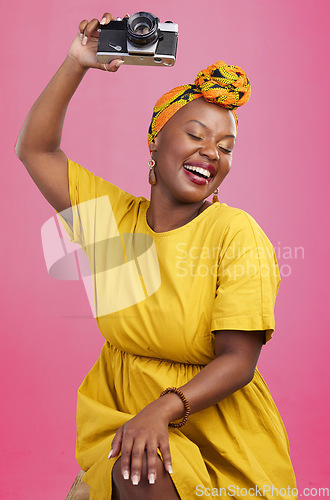 Image of Studio camera, photographer and happy black woman excited for lens photo, content creation or photography. Creative photoshoot, equipment and talent with African person smile on pink background