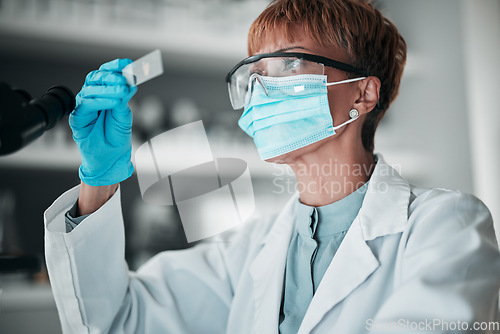 Image of Microscope slide, woman and research with healthcare, mask and particles with biotechnology, review sample and dna. Person, medical or scientist with face cover, laboratory equipment or data analysis