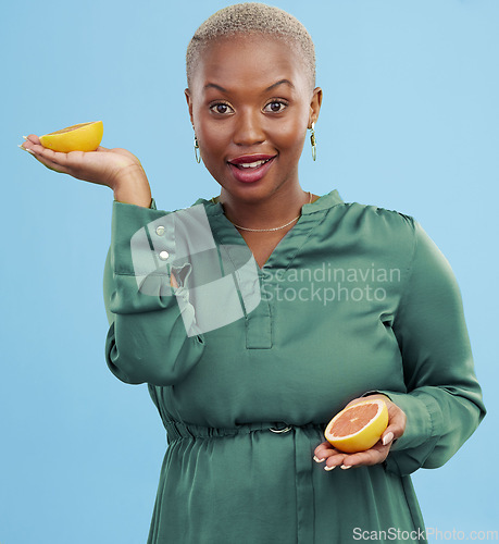 Image of Black woman, portrait and orange for vitamin C in diet, natural nutrition or detox against a studio background. Happy African female person smile with healthy organic citrus fruit for body wellness