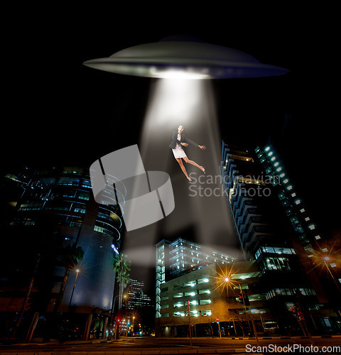 Image of UFO spaceship, person and abduction in street, city and tractor beam for abduction, search and light. UAP ship, flying saucer and lights in dark cityscape, metro and cbd for galaxy, flight or woman