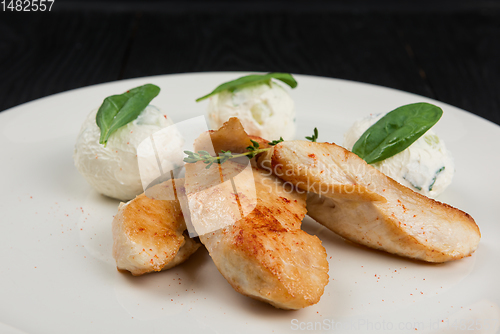 Image of Grilled chicken breast with mozzarella cheese.