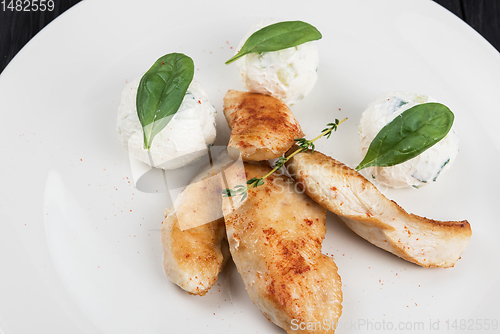 Image of Grilled chicken breast with mozzarella cheese.