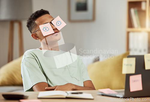 Image of Education, sticky notes and a man student sleeping at his desk in the bedroom while learning for school. Burnout, tired and exhausted with a young university or college pupil asleep in his home