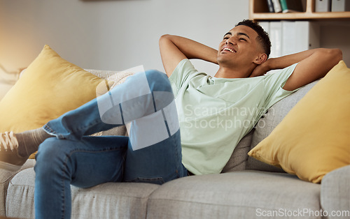 Image of Relax, calm and man in a sofa happy, chilling and enjoy weekend freedom at home. Resting, peace and male person in a living room with break, day off or weekend me time, smile and stress free in house