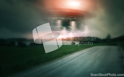 Image of UFO, spaceship and countryside with alien in sky for fantasy or science fiction event in nature, field or landscape with clouds. Earth, aliens and extraterrestrial drone in environment with blur