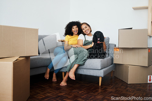 Image of New home, portrait and lesbian couple with a dog on the sofa for moving boxes and relocation. Smile, lgbt and women or people on the living room couch of an apartment with a pet and a homeowner