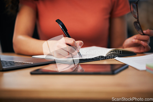 Image of Notebook, office and hands of person writing summary notes, schedule or event planner working on appointment calendar. Project, closeup secretary and receptionist planning agenda, journal or report