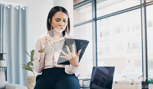 Image of Businesswoman in office, reading and thinking with tablet for email, HR schedule or report online for feedback. Research, networking and communication on digital app, woman at human resources agency.