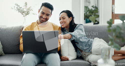 Image of Couple, laptop and laugh on sofa in home for love, watch movies and streaming multimedia. Happy man, woman and talk about funny meme on computer, social media post and online shopping in living room