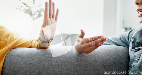 Image of Argument, hands and closeup of couple on a sofa in the living room for cheating, fight or toxic relationship. Conversation, discussion and zoom of man and woman talking for communication at home.