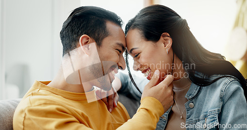 Image of Couple, forehead touch and relax on sofa with love, bonding and happy people together at home. Healthy relationship, trust and support in commitment, partner and marriage, romance and intimacy