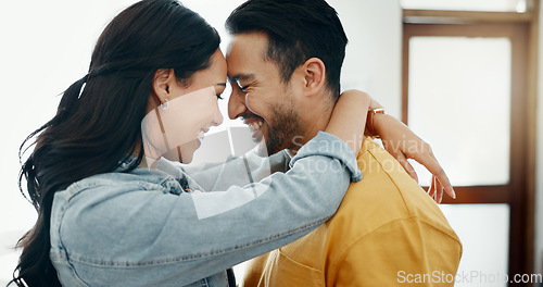 Image of Couple, forehead touch and hug in living room with love, bonding and happy people together at home. Healthy relationship, trust and support in commitment, partner and dancing, romance and intimacy