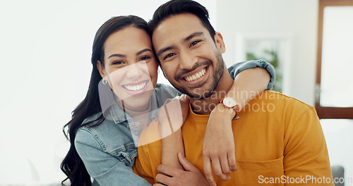 Image of Couple, hug in portrait and relax in lounge with love, bonding and happy people together at home. Healthy relationship, trust and support in commitment, partner and marriage with romance and intimacy