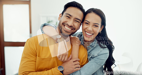 Image of Couple, hug in portrait and relax in lounge with love, bonding and happy people together at home. Healthy relationship, trust and support in commitment, partner and marriage with romance and intimacy