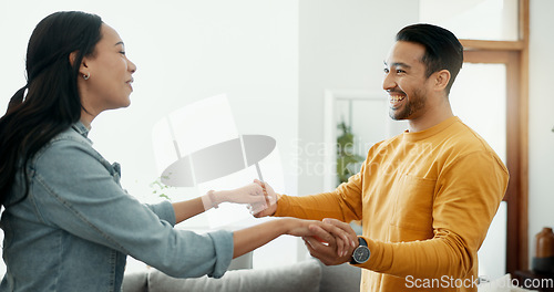 Image of Couple, dancing in living room and love, bonding and happy people together at home. Healthy relationship, trust and support in commitment, partner and marriage, romance and intimacy with laughter