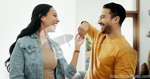 Image of Couple, dancing in living room and love, bonding and happy people together at home. Healthy relationship, trust and support in commitment, partner and marriage, romance and intimacy with laughter